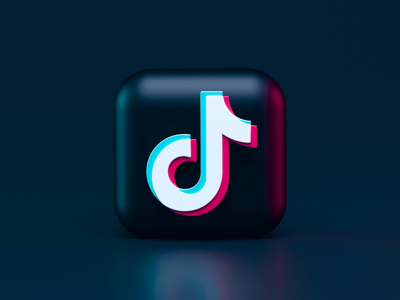 TikTok logo on a dark backdrop.