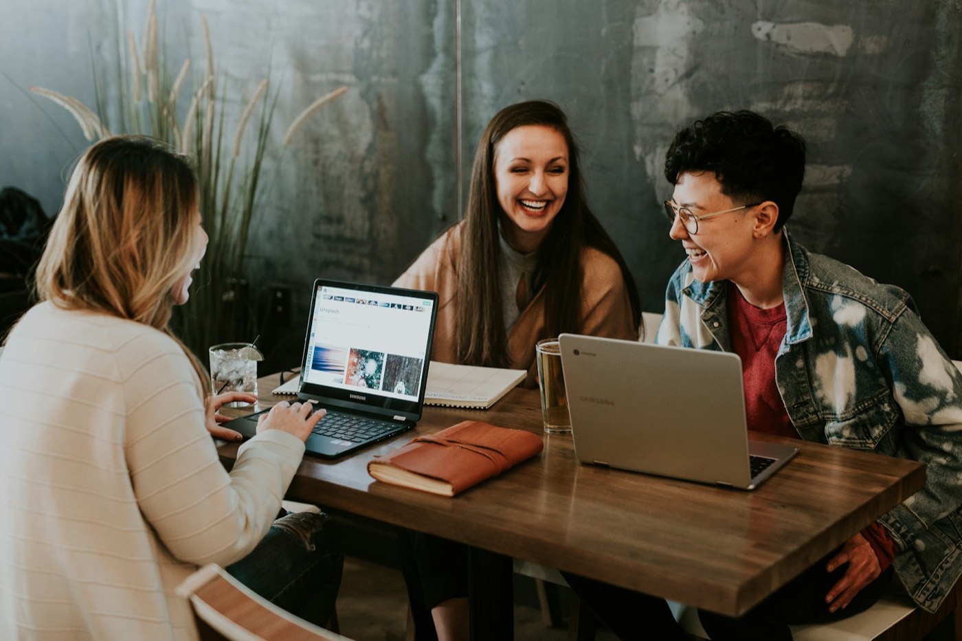 People learning together around laptops.